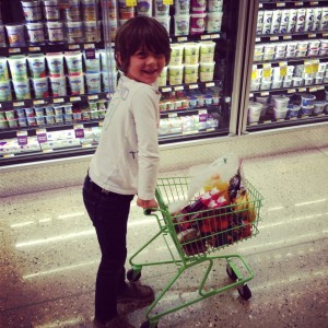 little boy shopping at whole foods